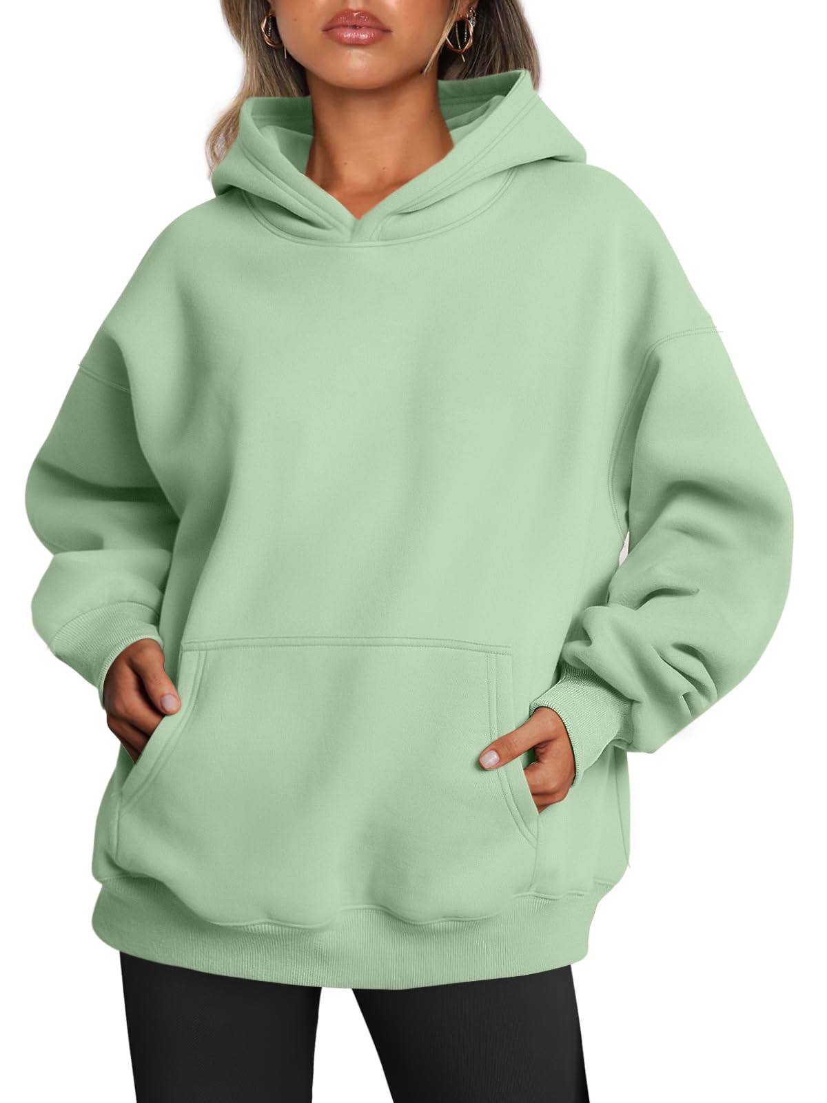 Detail of the neckline and hood seam on the women's oversized sweatshirt