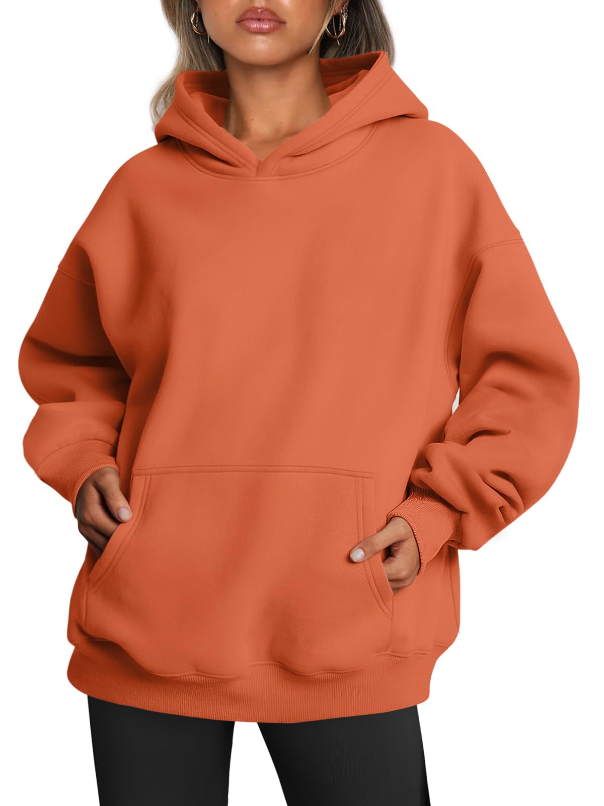 Close-up of the ribbed hem and side seam on the oversized women's hoodie