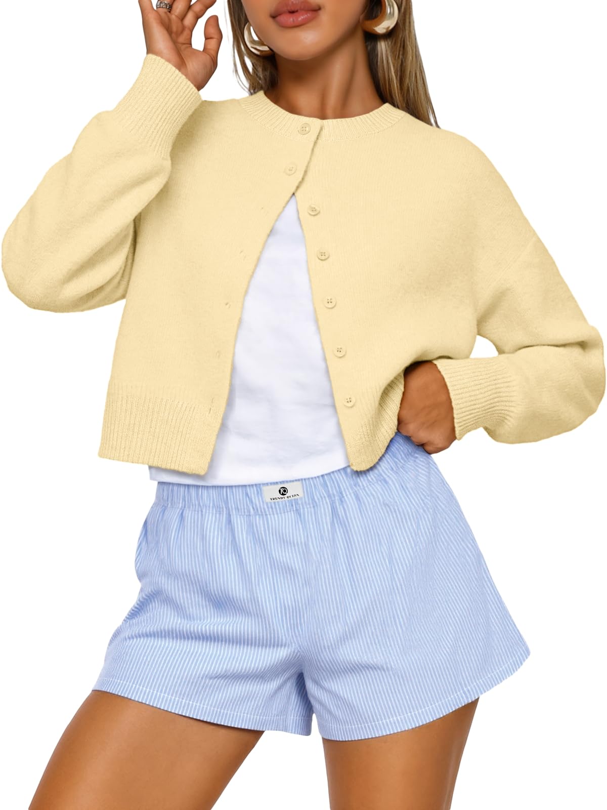 Sleeve and cuff detail of the cropped knit cardigan
