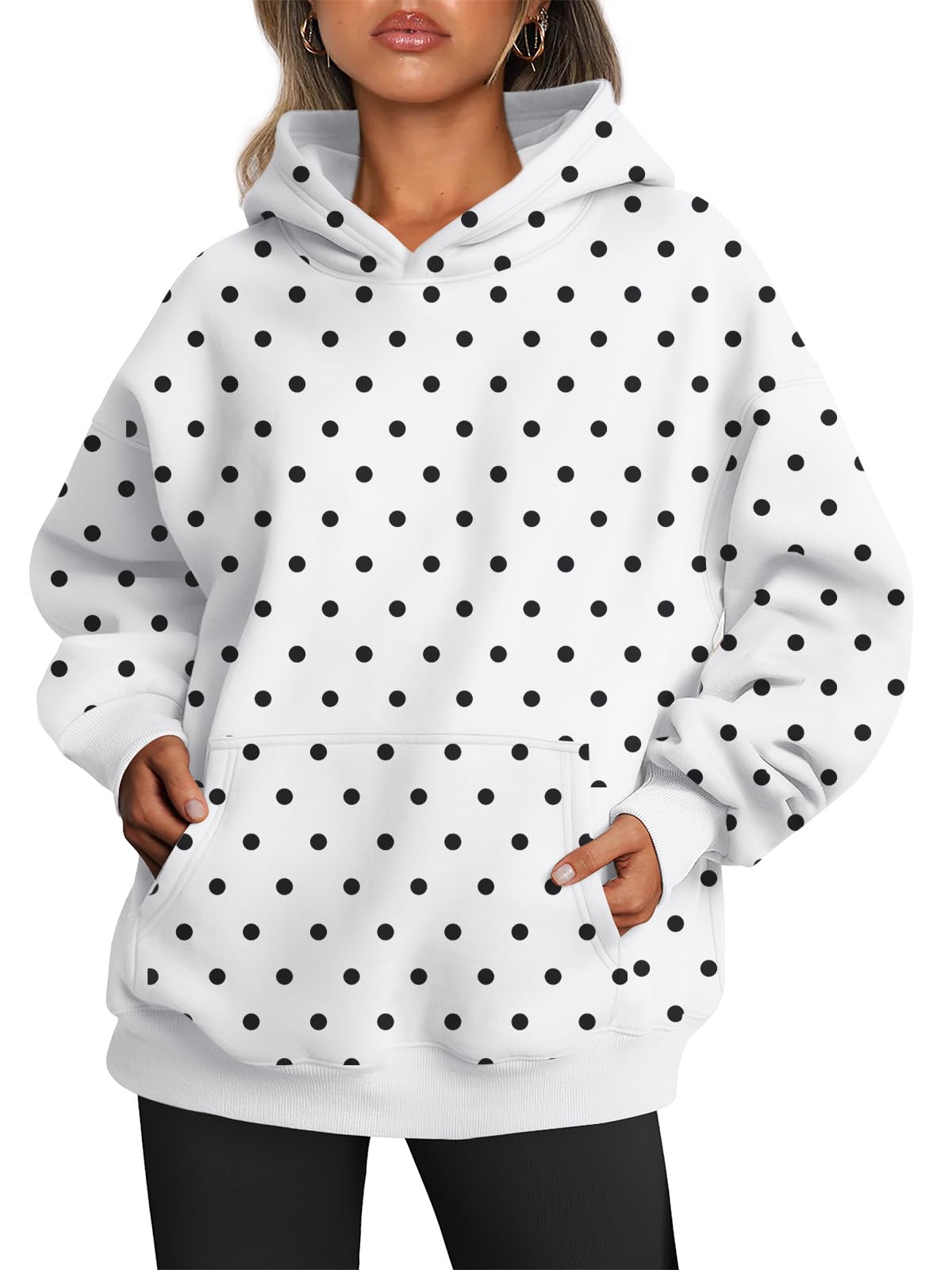 Women's oversized hoodie worn with the hood up, front angle