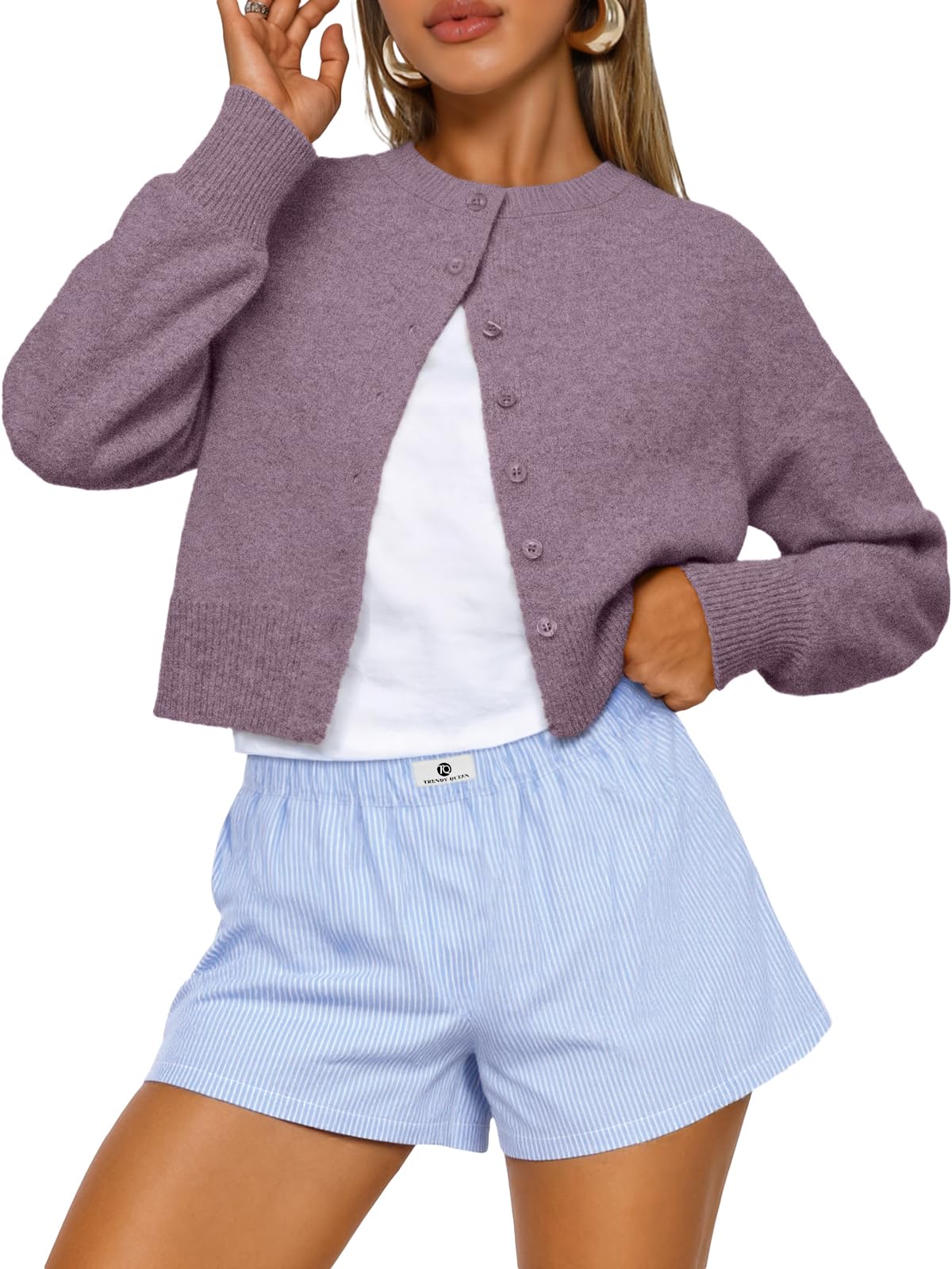 Cropped cardigan sweater shown in a close front view on a hanger