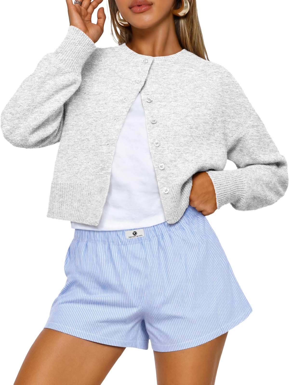 Back view of the cropped cardigan sweater highlighting the knit pattern