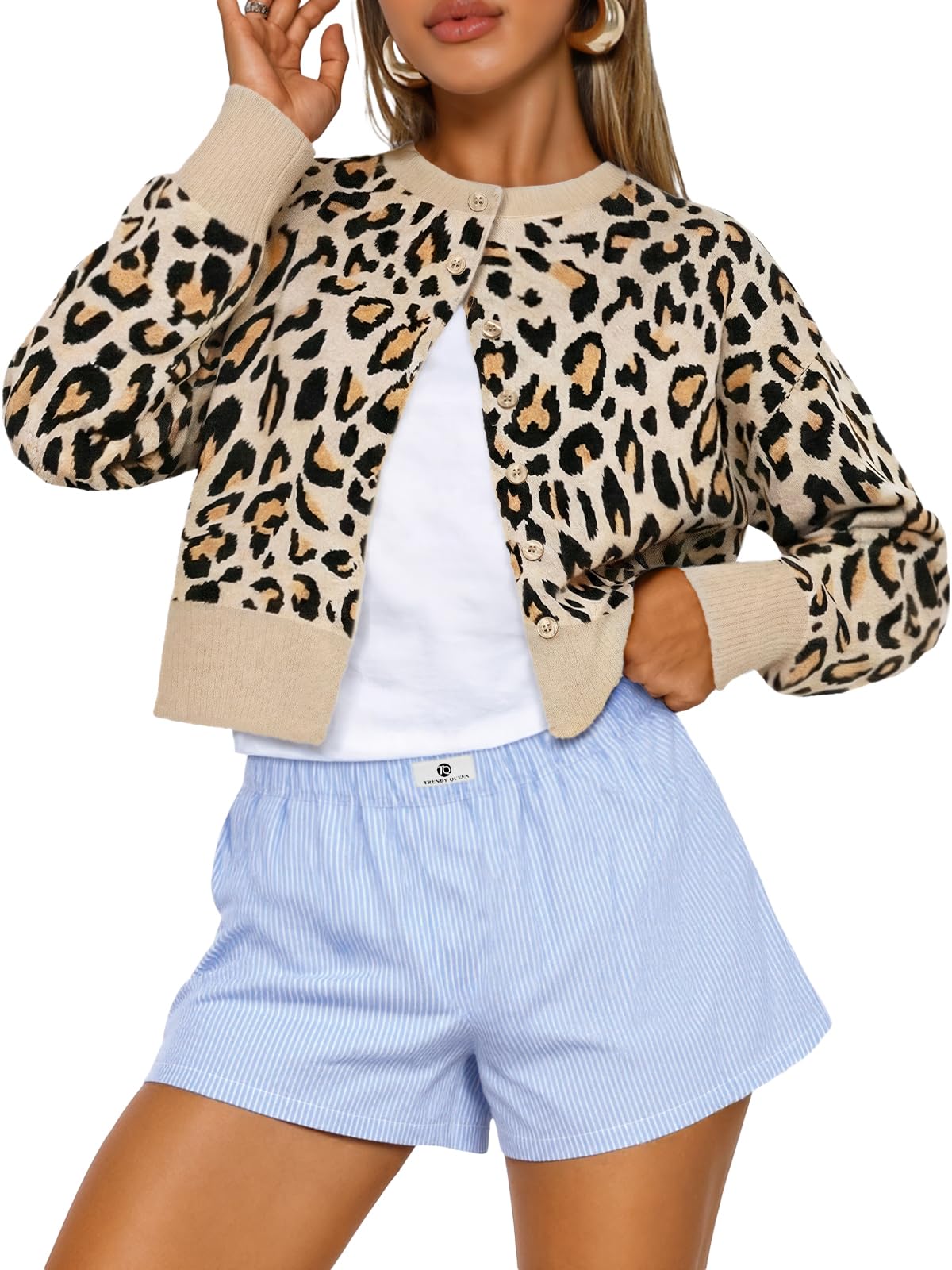 Cropped cardigan sweater displayed on a hanger against a plain background