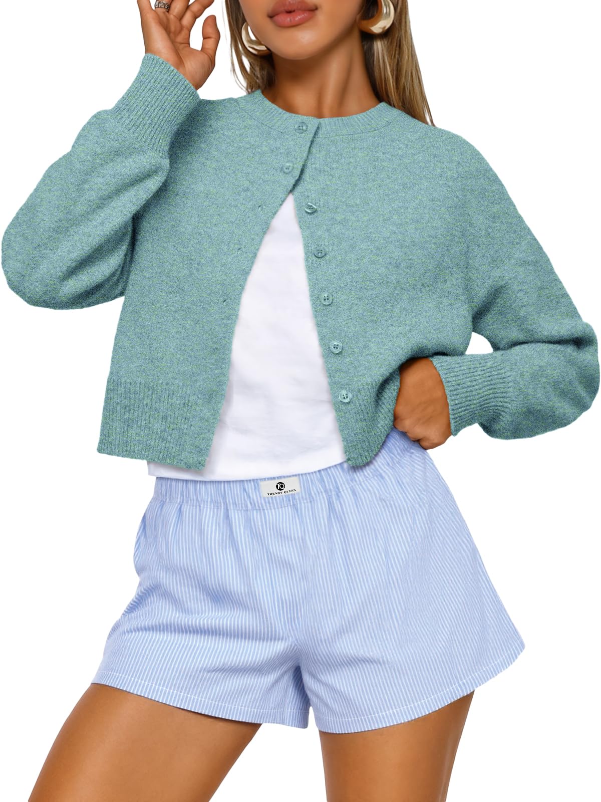 Cropped cardigan styled with high-waisted jeans for a trendy fall look