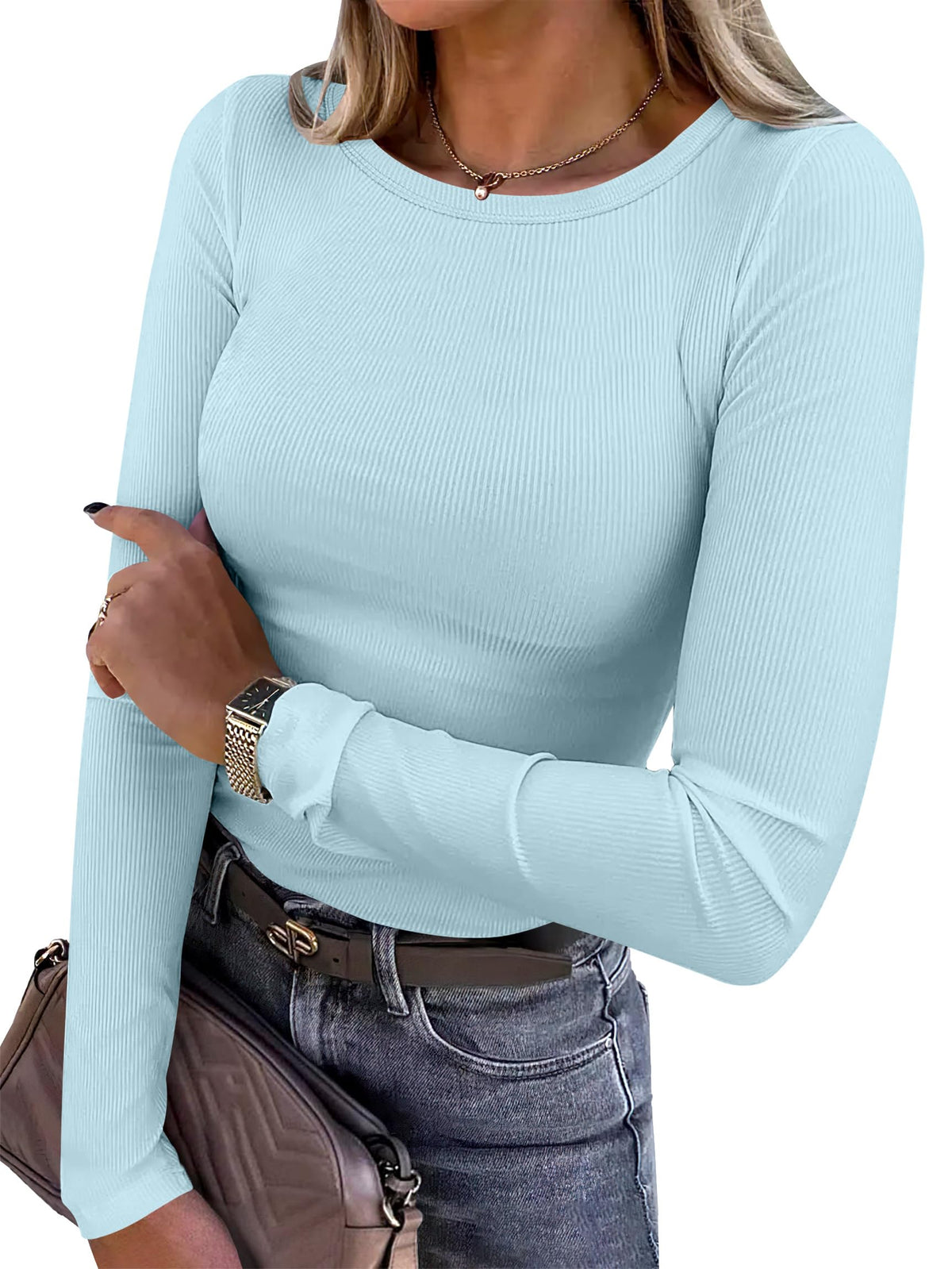 Women's long sleeve ribbed fitted top shown from the front in a relaxed pose